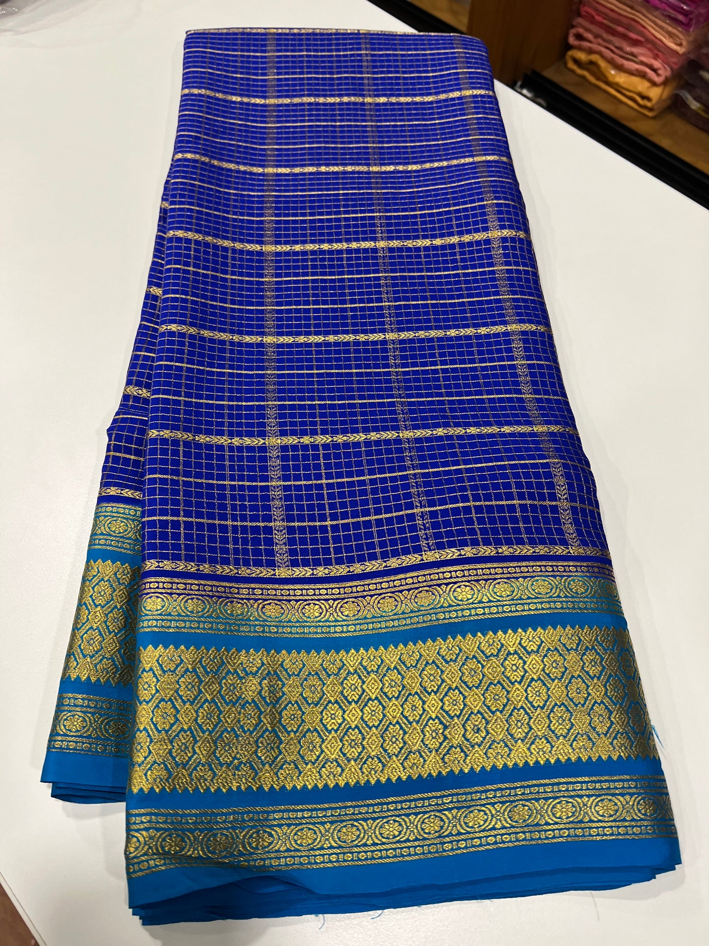 Checks pattern with rich pallu