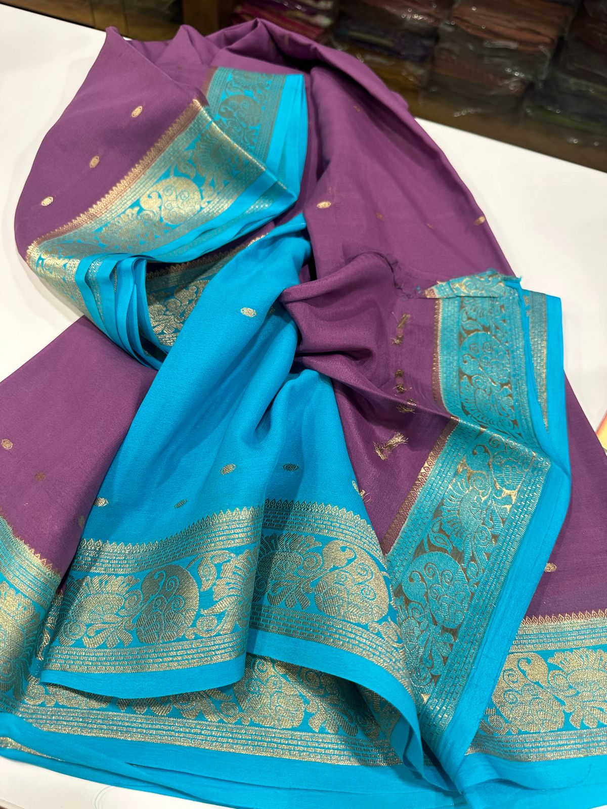 Pure Mysore Silk Saress Traditional borders which comes with contrast color blouse and Pallu with motif pattern